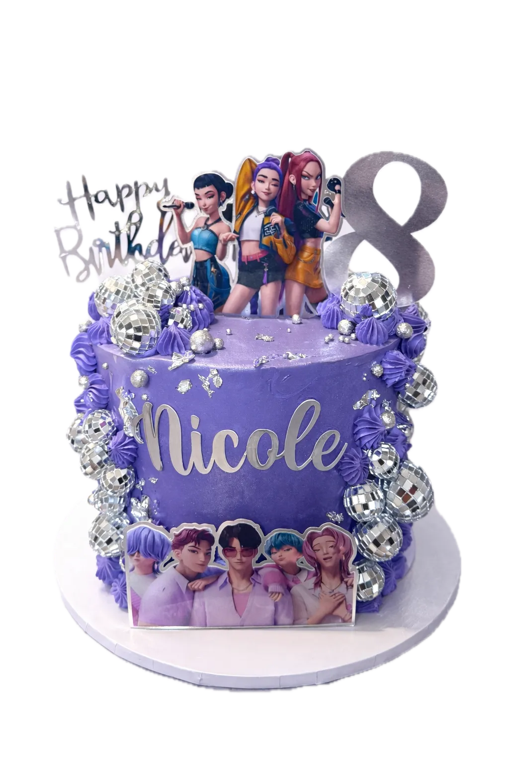 Multi-tiered purple cake with floral piping, lavender and blackberry
